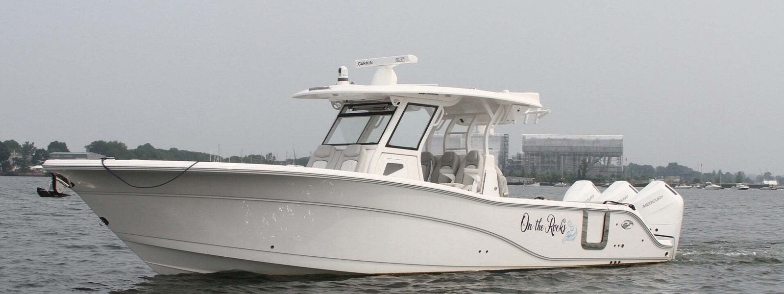 Boat with a Custom Name Sailing near the Sea