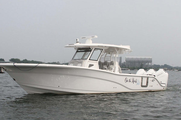 Boat with a Custom Name Sailing near the Sea